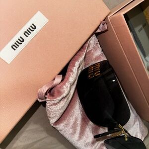 Miu Miu Black and Gold Sunglasses